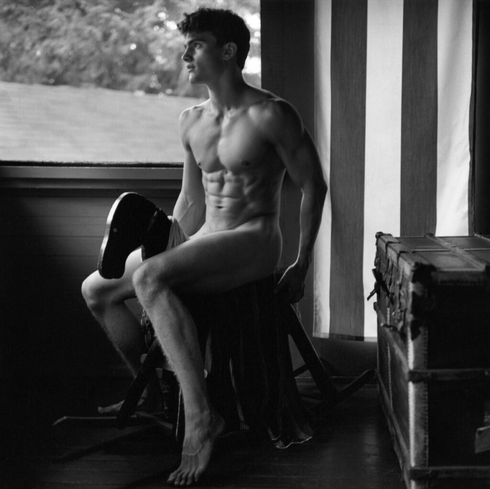 Peter Johnson on rocking horse, Camp Longwood, Adirondacks